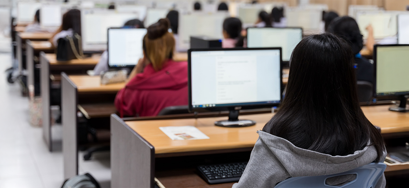 Students using computers in a classroom.