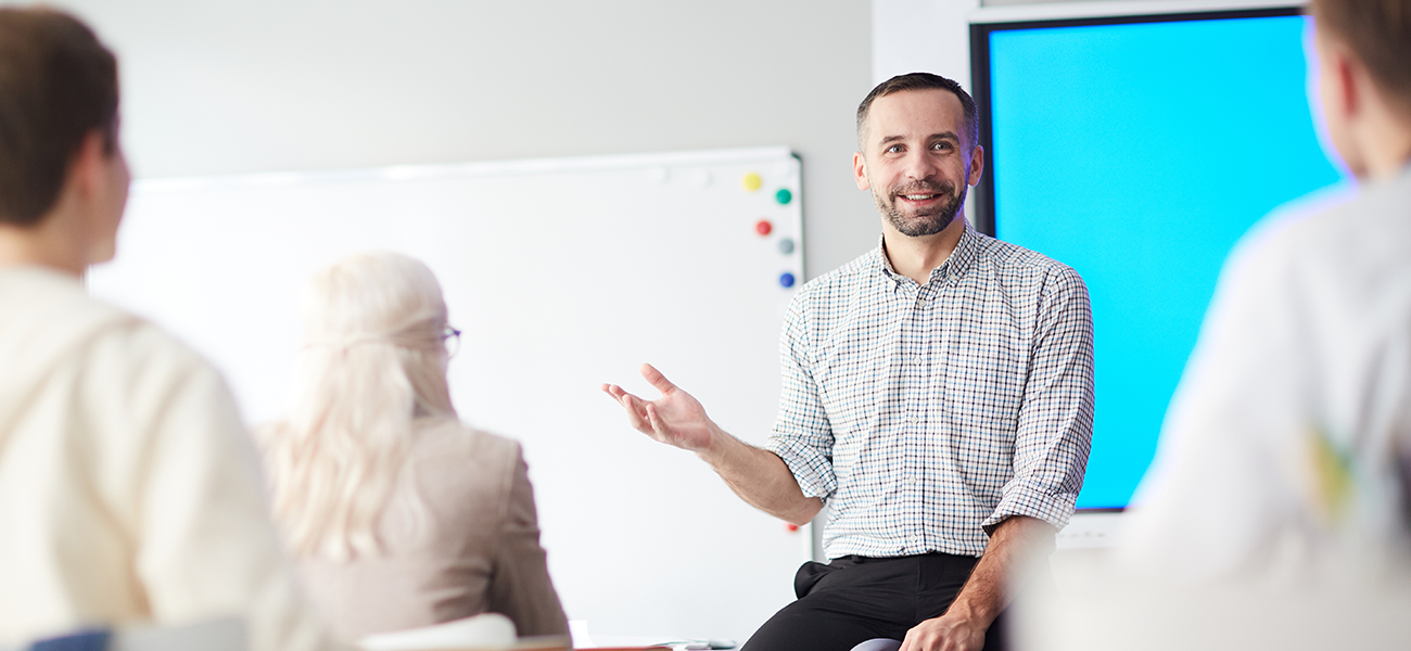 A school administrator talking to a class of other school administrators.