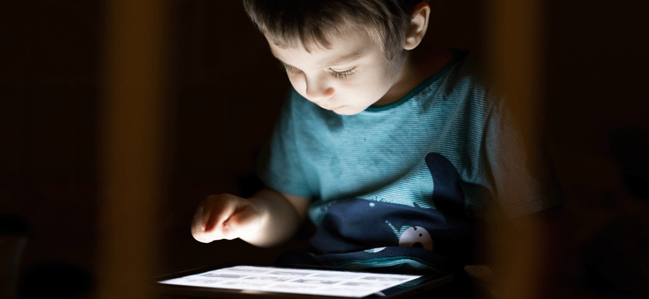 Child using an iPad at home.