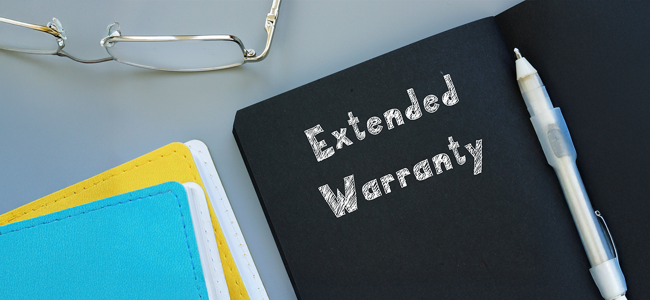 Extended warranty written out on a folder.
