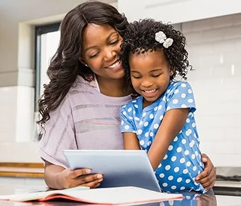 Mom and Daughter Using Tablet